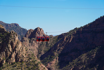 An aerial gondola travels high above the canyon floor of the Royal Gorge in Southern Colorado © Moment of Perception