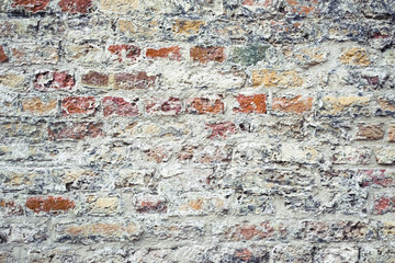 Abstract construction background with detail of damaged gray plastered wall and  façade renovation works of a historic old building in Budapest, Hungary. 