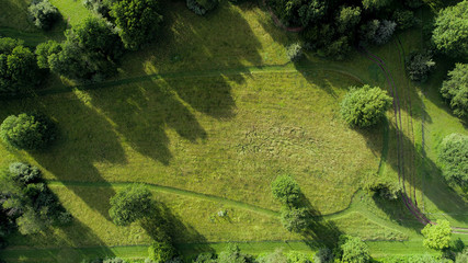Overhead drone photo of countryside hay field just before sunset