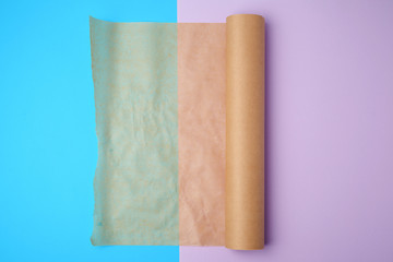 unwrapped a roll of brown parchment paper on a colored background
