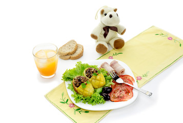 Children's meal - stuffed with potatoes, vegetables and bacon on the table close-up