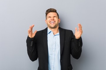 Young handsome caucasian man joyful laughing a lot. Happiness concept.