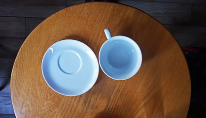 white coffee mug empty on the wooden table