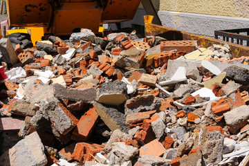 disposed red bricks piled up on junkyard