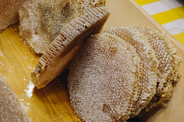 Honey in honeycomb from round beehive with  honey