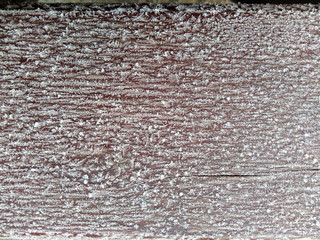 brown board covered with white small snowflakes 9