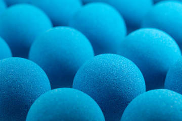 Blue bath bombs on white tabletop
