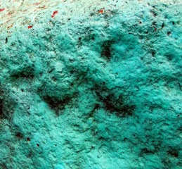 Old painted granite stone rock background. Green, cyan, turquoise, aquamarine.