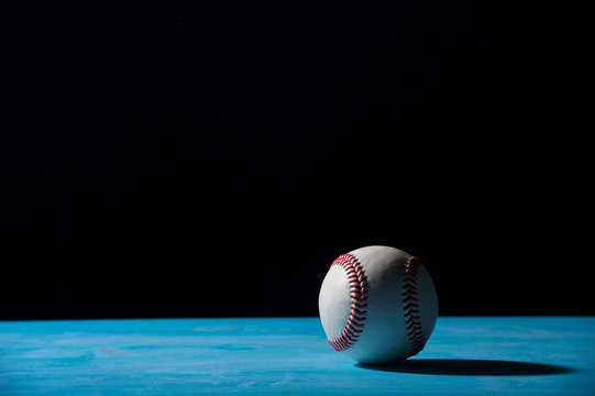 Baseball Ball On  Blue Wooden Table