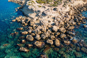 Cyprus coastline aerial top view from drone, Stone Rocks and azure mediterranean sea water in sunny day as beautiful nature resort background.