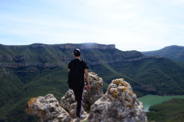 Fototapeta premium Boy Looking at the Mountain and Lake Landscape view