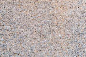 Texture image of a fragment of an old slab of pressed sawdust