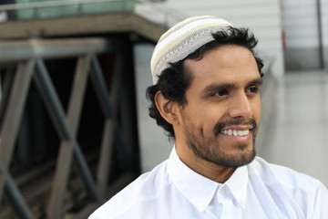 Islamic man smiling and looking away