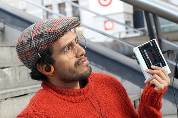 Retro looking guy listening to music 