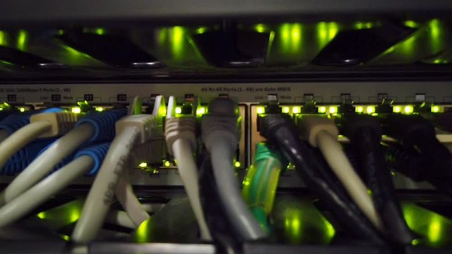 Back panel of powerful servers installed in the rack of the server room of the data center
