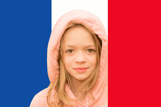 Little girl on the background of the flag of France