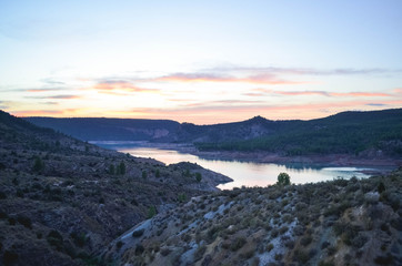 Fototapeta na wymiar Amazing Sunset with Lake between the Mountains