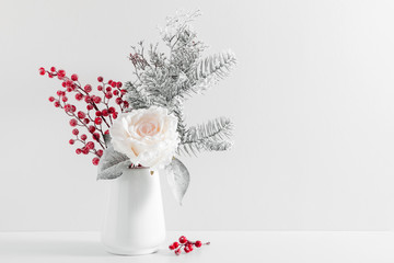 Winter composition, decoration, flowers, branches in vase on white background. Christmas, New Year,...
