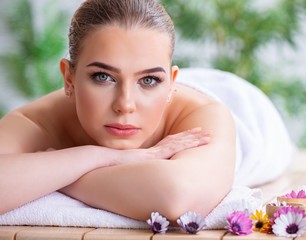 Obraz na płótnie Canvas Woman during massage session in spa