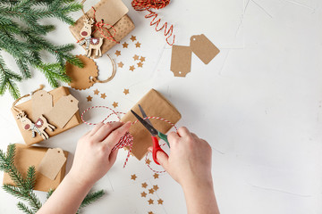 Woman's hands wrapping christmas