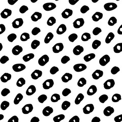 Seamless pattern with blob strokes made by hand with ink and brush. Doodle style.  Black particles isolated on white backgorund. Repeatable. Use it for backdrop, wrapping paper, textile design