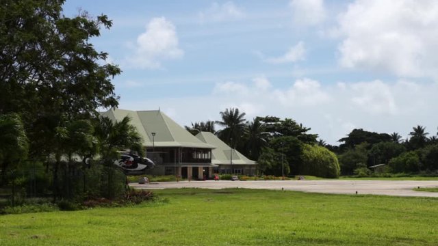 Air Seychelles de Havilland Canada DHC-6-400 twin-engine turboprop regional airliner aircraft taxiing on small tropical Praslin island airport and eventually taking off, heading to Mahe on sunny day.