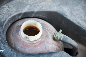 Opened cooler tank deposit container to check for the level of the liquid. Antifreezing cooling system.