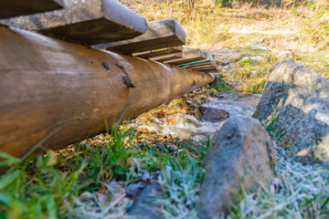 Bridge over the river in the woods. Wooden bridge over forest mountain river. Kazakhstan