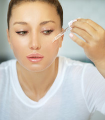 Magic anti-aging cream.Applying the cream	