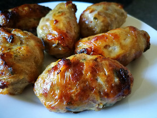 Grilled Sausages on a White Plate. Traditional Cypriot food: Sheftalia : Cypriot Lamb and Pork Sausages.