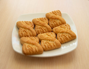 The photo of a pile of  cookies or shortcake biscuits on the plate. National Cookie Day background
