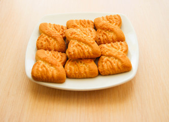 The photo of a pile of  cookies or shortcake biscuits on the plate. National Cookie Day background