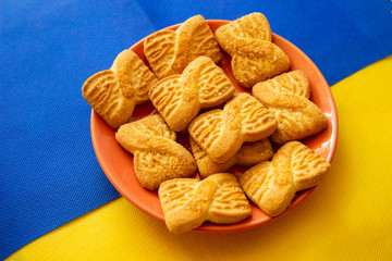 The photo of a pile of  cookies or shortcake biscuits on the plate. National Cookie Day background