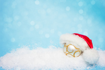 Christmas card, with a ball for the Christmas tree in Santa Claus hat, Copy space