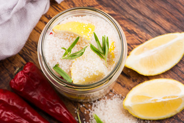 Preserved Lemons with salt on a wooden board