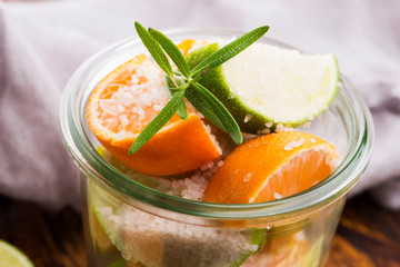 Preserved Lime and Mandarin with salt on a wooden board