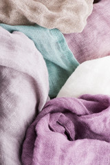 Multicolored textile with violet tones and colorful accents and rich, detailed texture, flax