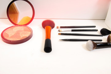 Makeup accessories on modern white wood 