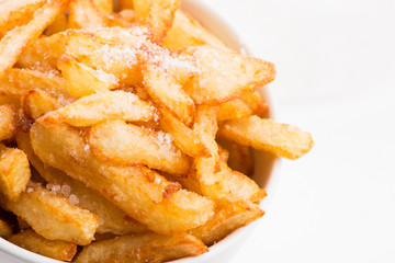 Bowl of potatoe fries on a white background