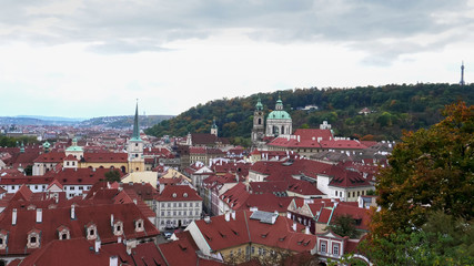 Naklejka na ściany i meble the red tiled roofs of prague buildings as seen from prague castle