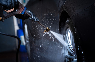 car wash, capturing the water sprayed at the wheels 