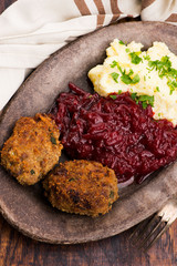 Prepared dinner on the plate. Melted meat, potatoes, beetroot