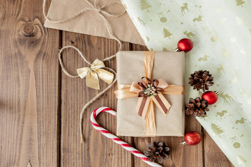 Christmas presents with ribbon on dark wooden background in vintage style