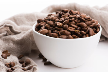 Bowl of caffee beans on a white background