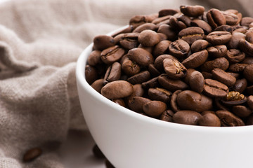 Bowl of caffee beans on a white background