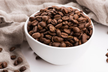 Bowl of caffee beans on a white background