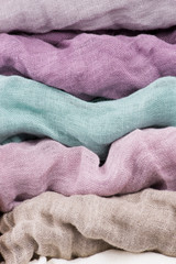 Multicolored textile with violet tones and colorful accents and rich, detailed texture, flax