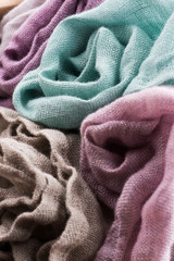 Multicolored textile with violet tones and colorful accents and rich, detailed texture, flax