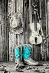 vintage image of cowboy hat and boots and a fiddle