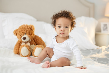 Cute baby with fluffy hair. Pretty boy.